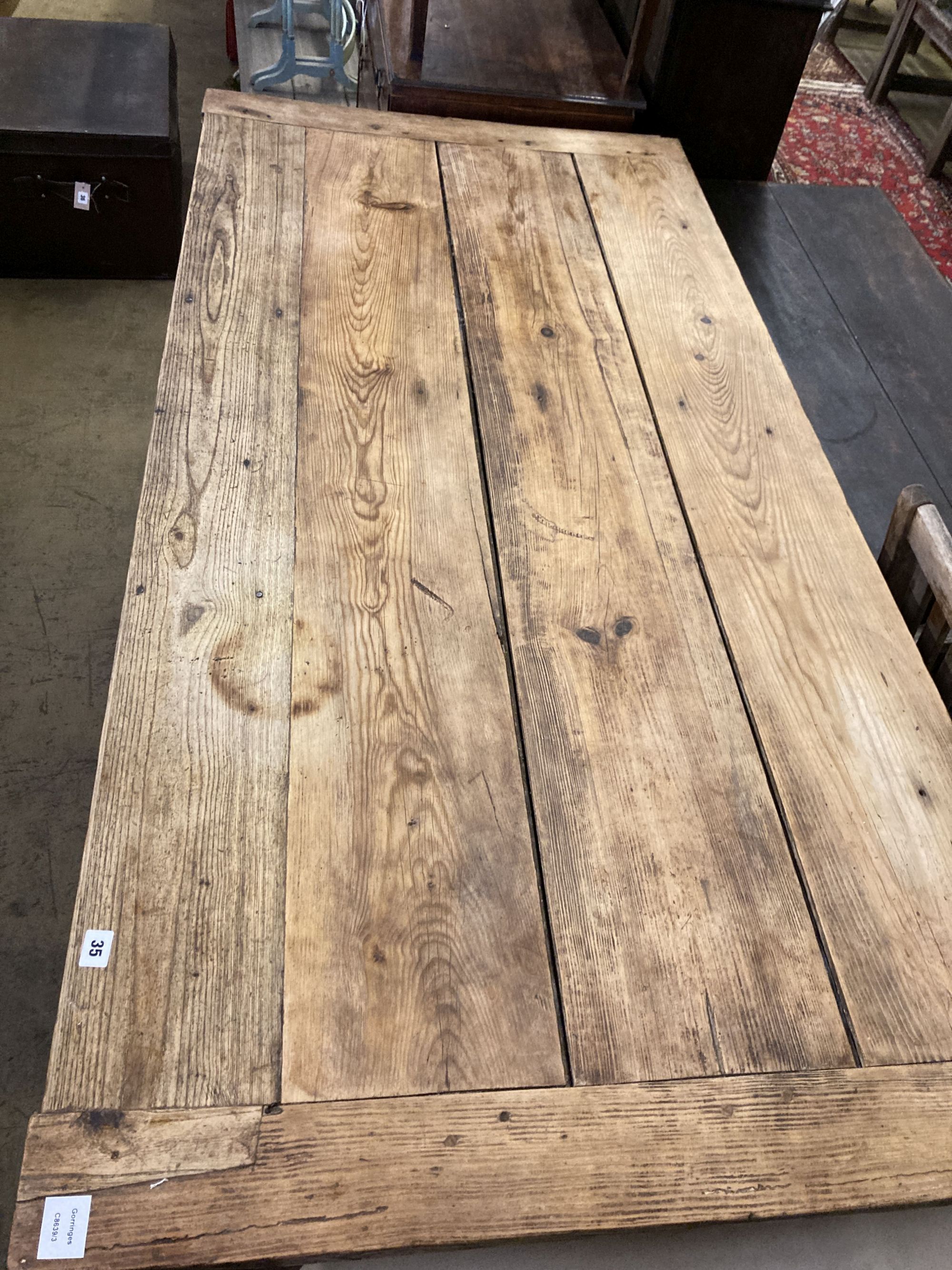 An early 19th century ash and pine rectangular kitchen table, width 186cm, depth 90cm, height 82cm